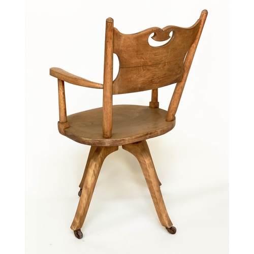 113 - DESK CHAIR, English 1930s oak with pierced back and revolving solid elm seat, 54cm W.