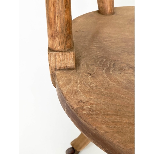 113 - DESK CHAIR, English 1930s oak with pierced back and revolving solid elm seat, 54cm W.