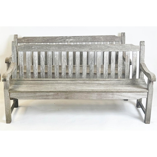 226 - GARDEN BENCHES, a pair, weathered teak of substantial slatted construction, 183cm W. (2)