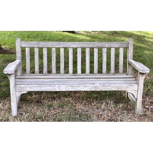 144 - LISTER GARDEN BENCH, well weathered teak slatted with broad flat top arms, 162cm W.