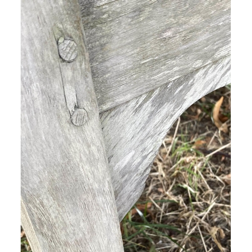 144 - LISTER GARDEN BENCH, well weathered teak slatted with broad flat top arms, 162cm W.