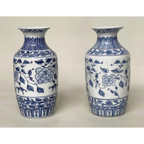 146 - TEMPLE VASES, a pair, Chinese blue and white ceramic peonies and fern collar, 45cm H. (2)