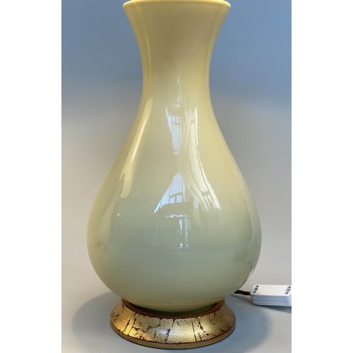 160 - TABLE LAMPS, a pair, 'Louisa' lemon yellow glazed ceramic of vase form with giltwood bases and spun ... 