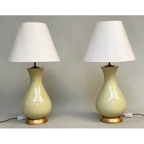 160 - TABLE LAMPS, a pair, 'Louisa' lemon yellow glazed ceramic of vase form with giltwood bases and spun ... 