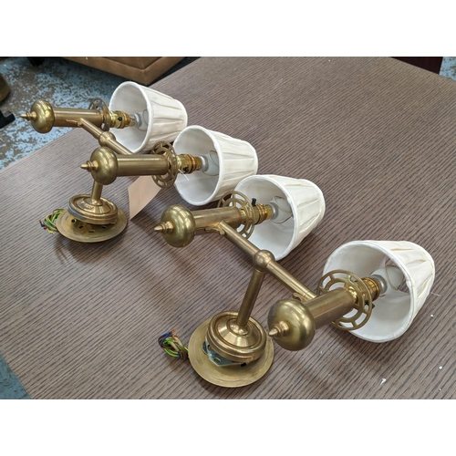 251 - BRASS SINGLE LIGHT WALL SCONCES, a set of five, 51cm H, adjustable with green shades and a pair of b... 