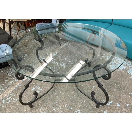 268 - CIRCULAR GLASS DINING TABLE, 160cm W x 78cm H, on a scrolled wrought metal base.