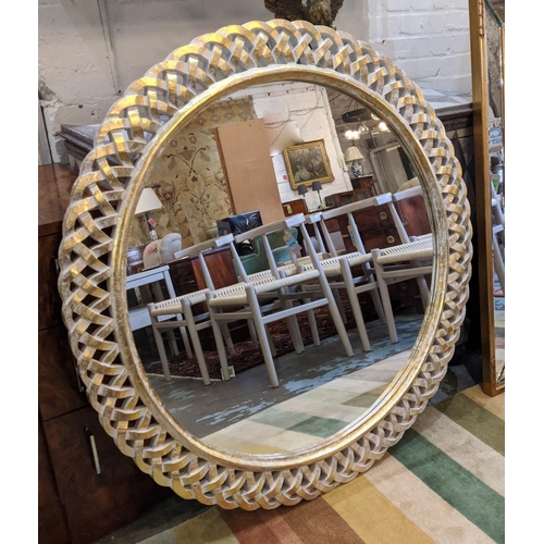 291 - WALL MIRROR, 107cm diam circular with a lattice border.