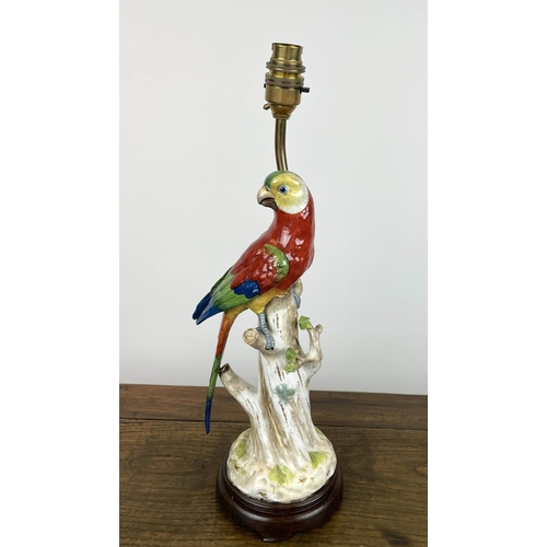 4 - PARROT LAMPS, a pair, porcelain modelled perched on three stumps in bright painted coloured, 41cm H.... 