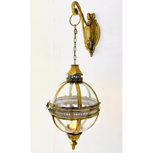 247 - WALL HANGING CANDLE LANTERNS, a pair, on brackets, gilt metal and glass, regency style design, 80cm ... 