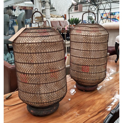 302 - ORIENTAL LANTERNS, a pair, with internal lights, metal and paper wood bases, 77cm H each. (2)