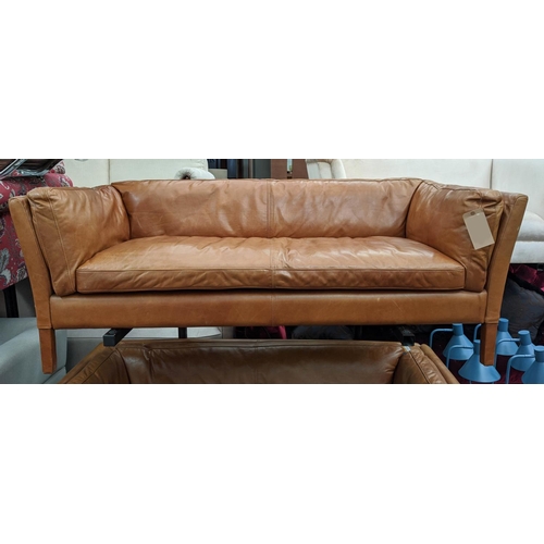 182 - SOFA, 177cm W x 64cm H x 79cm D, in a brown leather in a mid 20th century Danish inspired style.