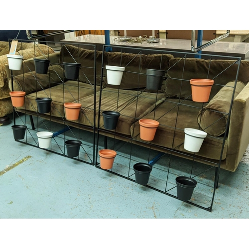 279 - WALL MOUNTING PLANT DISPLAY RACKS, a pair, each with nine pots, 90cm x 90cm. (2)