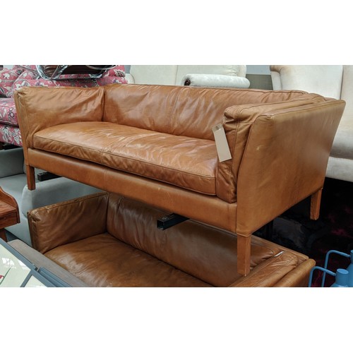 183 - SOFA, 177cm W x 64cm H x 79cm D, in a brown leather in a mid 20th century Danish inspired style.