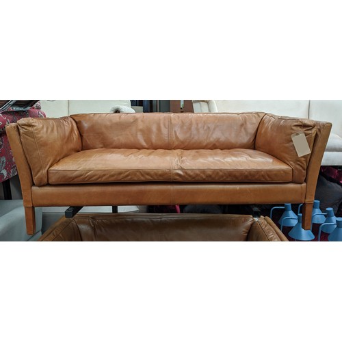 183 - SOFA, 177cm W x 64cm H x 79cm D, in a brown leather in a mid 20th century Danish inspired style.