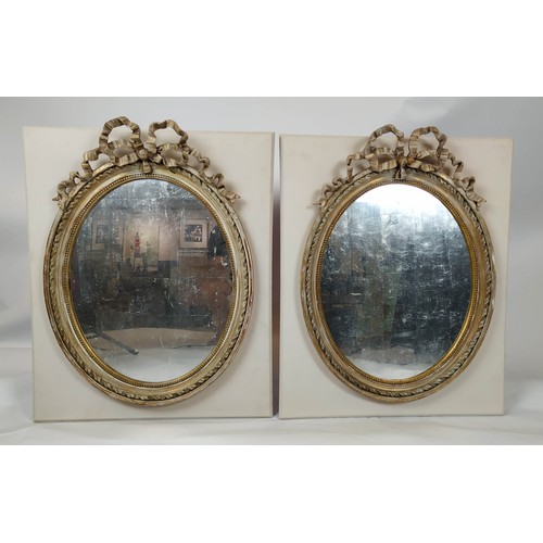 59 - WALL MIRRORS, a pair, Louis XVI style, applied to later boards, painted finish, 19th century oval fr... 
