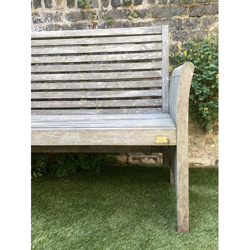 551 - GARDEN BENCH, weathered teak with horizontal slat back and seat and downswept arms by 'Trinity', 162... 