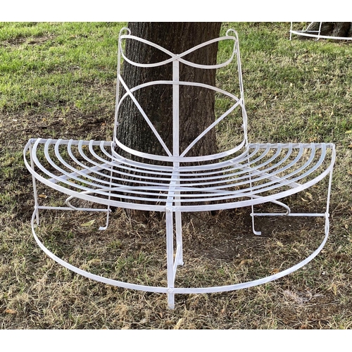 278 - GARDEN TREE BENCH, painted wrought iron of slatted concentric form with scroll decoration in two par... 