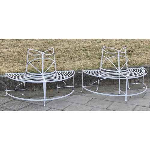 278 - GARDEN TREE BENCH, painted wrought iron of slatted concentric form with scroll decoration in two par... 