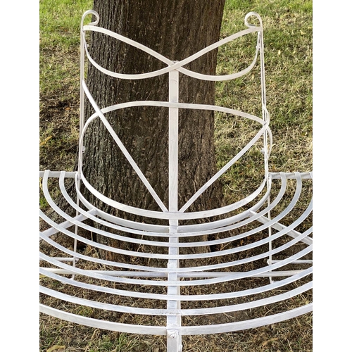 278 - GARDEN TREE BENCH, painted wrought iron of slatted concentric form with scroll decoration in two par... 