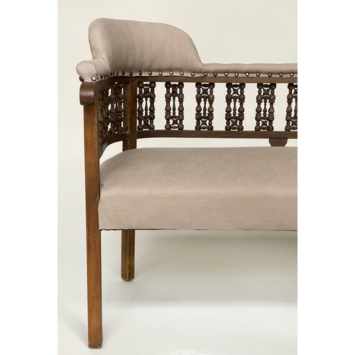 92 - HALL BENCH, early 20th century linen upholstered with Moorish style pierced fretwork back, 107cm W.