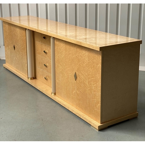 323 - TURRI SIDEBOARD, birds eye maple, and gilt metal mounted, with four drawers and two doors, shelves a... 