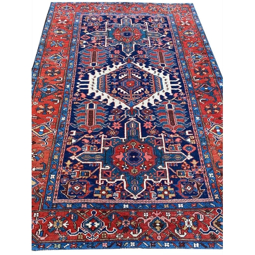 129 - ANTIQUE PERSIAN HERIZ RUG, 207cm x 140cm