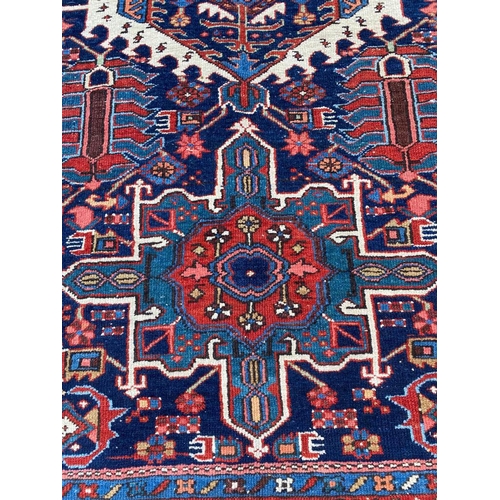 129 - ANTIQUE PERSIAN HERIZ RUG, 207cm x 140cm