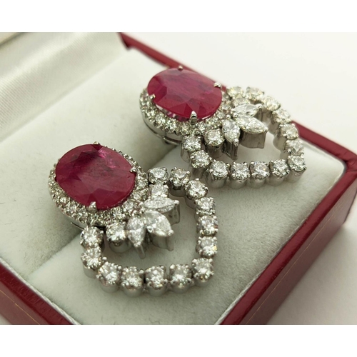 13 - A PAIR OF 18CT WHITE GOLD RUBY AND DIAMOND EARRINGS, each set with a single natural oval mixed cut r... 