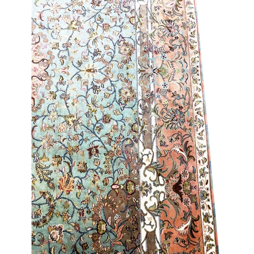 131 - FINE PURE SILK TEHRAN DESIGN CARPET, 305cm x 185cm.