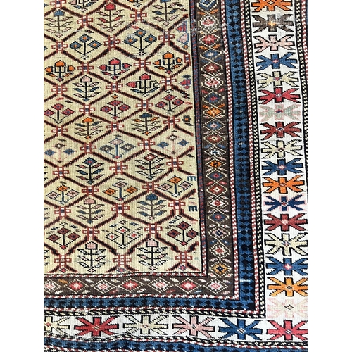 144 - ANTIQUE CAUCASIAN RUG, 185cm x 122cm.