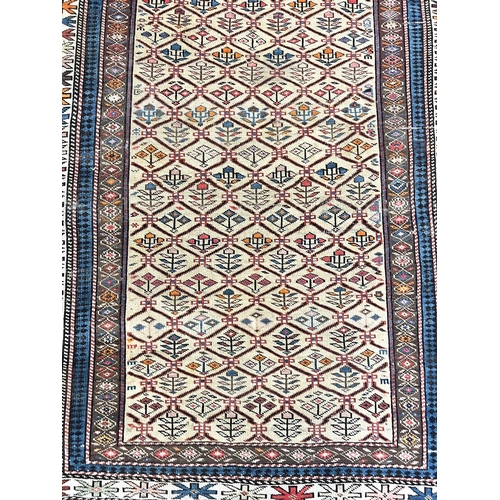 144 - ANTIQUE CAUCASIAN RUG, 185cm x 122cm.