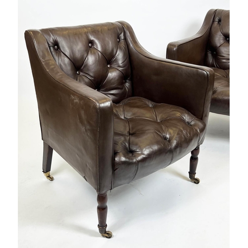 168 - CLUB ARMCHAIRS, a pair, each 65cm W x 75cm tall in buttoned brown leather, on turned supports, Prove... 