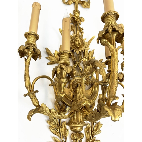 169 - WALL SCONCES, a pair, each 95cm x 40cm, late 19th century French gilt bronze with ribbon, floral, fo... 