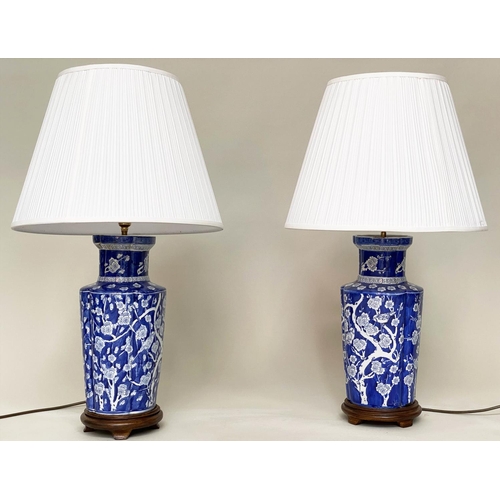 174 - TABLE LAMPS, a pair, Chinese white on blue ceramic of ribbed vase form with birds and blossom, 80cm ... 