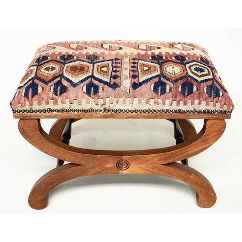 186 - KELIM FOOTSTOOL, Regency style mahogany with antique brass studded Kelim upholstery and  'X' form su... 