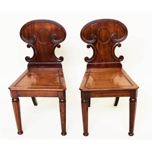 192 - HALL CHAIRS, a pair, 19th century William IV mahogany, each with scroll carved back and facetted fro... 