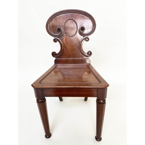 192 - HALL CHAIRS, a pair, 19th century William IV mahogany, each with scroll carved back and facetted fro... 