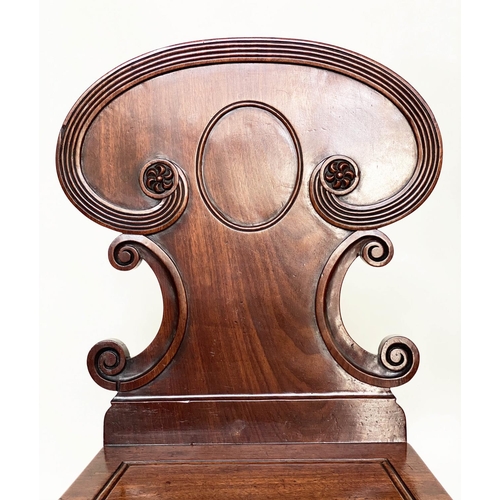 192 - HALL CHAIRS, a pair, 19th century William IV mahogany, each with scroll carved back and facetted fro... 