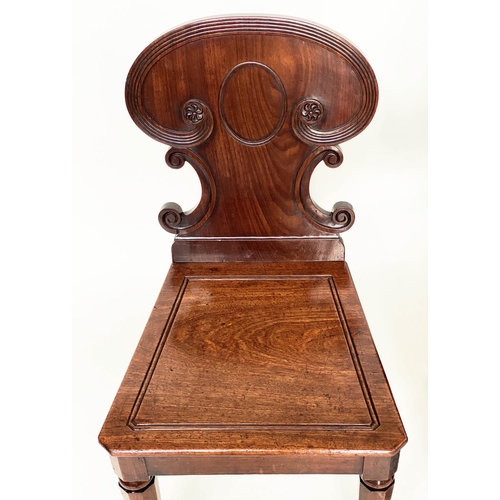 192 - HALL CHAIRS, a pair, 19th century William IV mahogany, each with scroll carved back and facetted fro... 