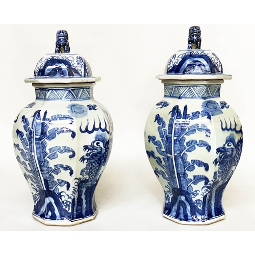 193 - TEMPLE JARS, a pair, Chinese blue and white ceramic with lids and facetted vase form, 68cm H. (2)