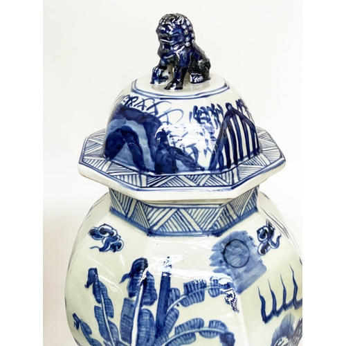 193 - TEMPLE JARS, a pair, Chinese blue and white ceramic with lids and facetted vase form, 68cm H. (2)