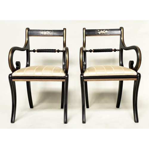 195 - ARMCHAIRS, a pair, Regency style lacquered and gilt lined with music trophy centre and scroll suppor... 