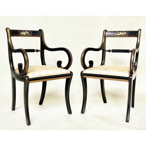 195 - ARMCHAIRS, a pair, Regency style lacquered and gilt lined with music trophy centre and scroll suppor... 