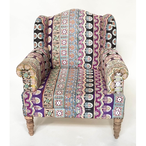 202 - WING ARMCHAIR, 19th century with Indian embroidered upholstery arched backed, scroll arms and turned... 