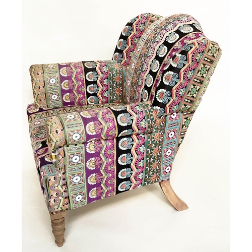 202 - WING ARMCHAIR, 19th century with Indian embroidered upholstery arched backed, scroll arms and turned... 