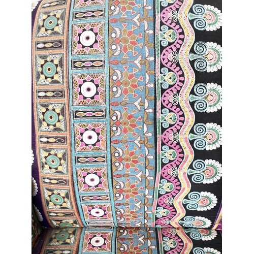 202 - WING ARMCHAIR, 19th century with Indian embroidered upholstery arched backed, scroll arms and turned... 