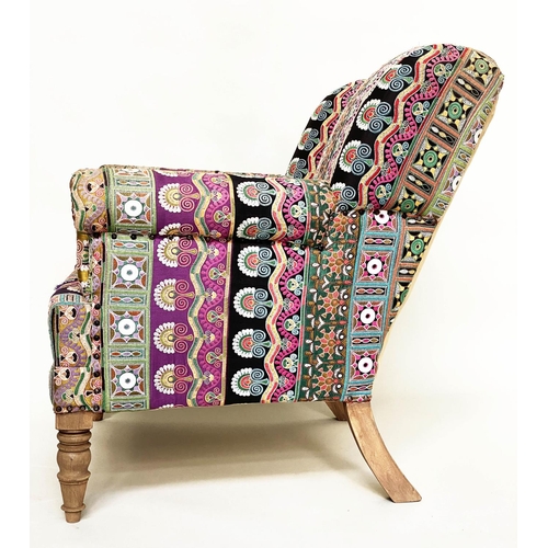 202 - WING ARMCHAIR, 19th century with Indian embroidered upholstery arched backed, scroll arms and turned... 