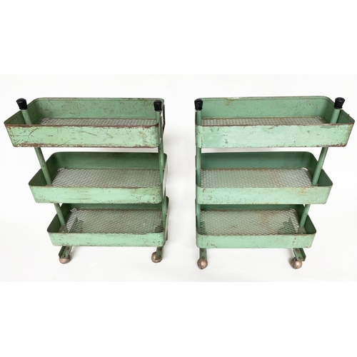 219 - WORKSHOP TROLLEYS, a pair, mid 20th century original green painted metal each with three tiers (on c... 