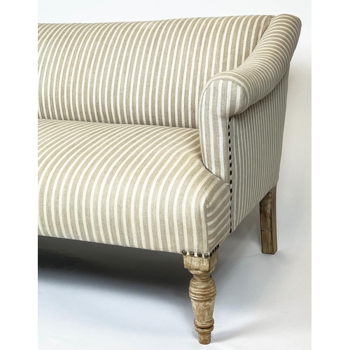 229 - SOFA, two seater, Victorian design with studded linen ticking upholstery and turned front supports, ... 