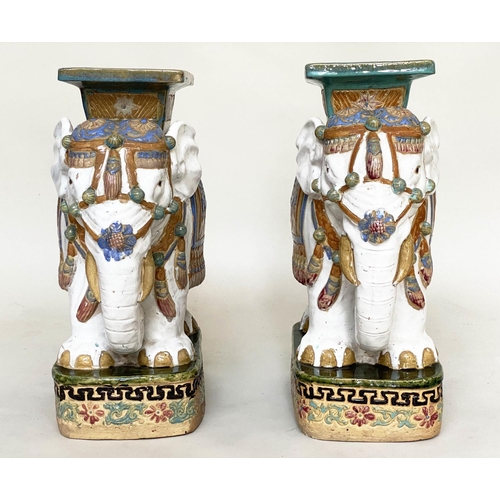 250 - ELEPHANT STOOLS, a pair, early 20th century Chinese ceramic white, green and blue in ceremonial atti... 